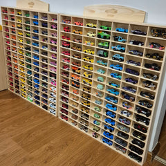 JCAR 105 — Diecast Display Rack with colorful diecast cars organized in wooden slots, helping families thrive with tools to calm, connect and support