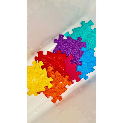 Rainbow Tactile Floor mat Set pieces in bright colors with varied textured surfaces for sensory stimulation and play