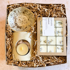 MELTING MOMENTS GIFT BOX with natural ceramic wax melter, scented tealight, and botanical wax melts in shredded filler.
