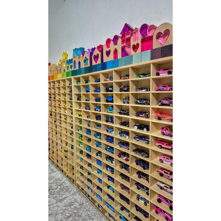 JCAR 105 — Diecast Display Rack with rainbow-colored compartments holding various small toy cars helping families thrive with tools to calm connect and support
