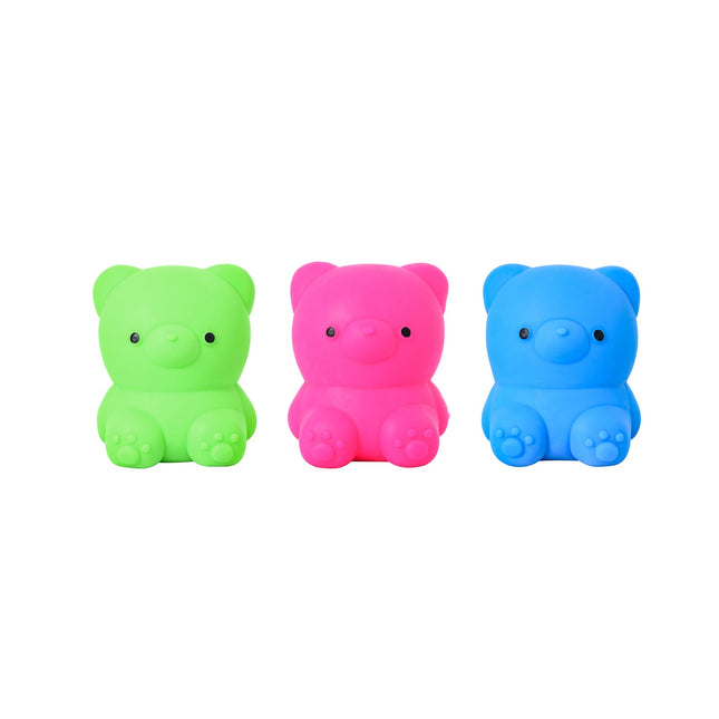 Three colorful pig-shaped squishies in green pink and blue on a white background