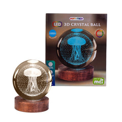 Jellyfish 3D Crystal Ball Lamp glowing on wooden base with jellyfish design inside, sensory lighting product.