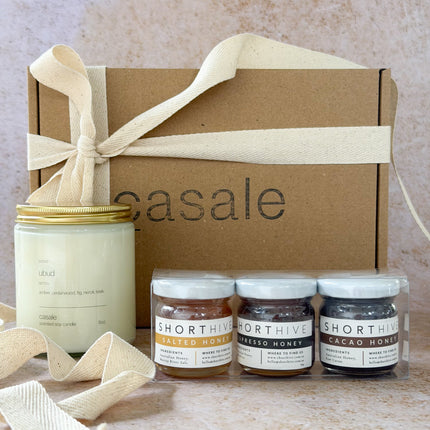Honeylight Gift Box with natural candle and three small jars of honey, helping families thrive with calm connection
