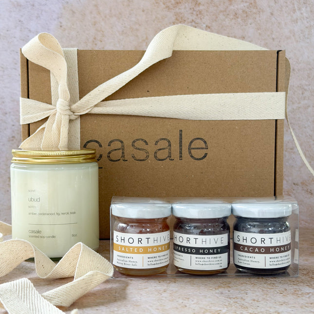 Honeylight Gift Box with natural candle and three small jars of honey, helping families thrive with calm connection