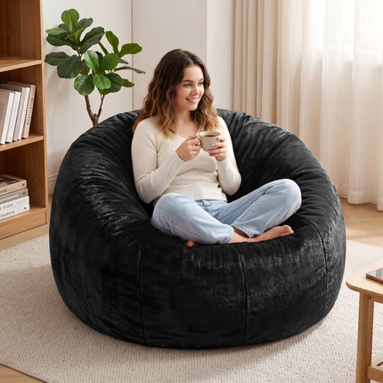Woman sitting on black Artiss Bean Bag Chair Cover (No Filler) Soft Faux Fur Beanbag Cover Large Round Stuffed Animal Storage Bean Bag Cover Washable Lazy Sofa Cover for Adults Kids T holding a cup in a cozy room