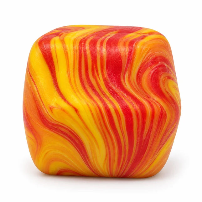 Yellow and red marbled cube shaped squishy sensory toy on a white background