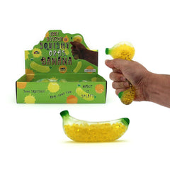 Squishy Water Orbs Banana sensory fidget toy filled with yellow water beads being squeezed by a hand