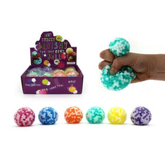 Squishy Water Orbs Two Tone Ball – 7cm sensory squishy balls shown in assorted colours and squeezed by hand
