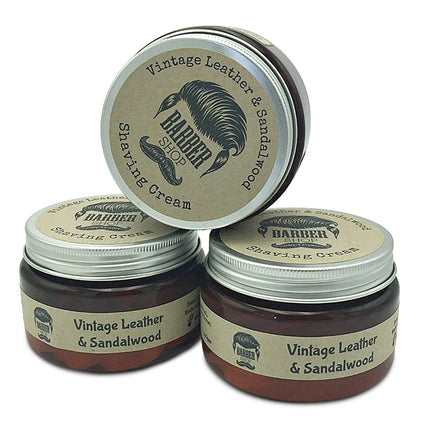 Three jars of Barber Shop Vintage Leather & Sandalwood Shaving Cream 150gm with vintage-style labels, stacked display.