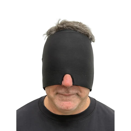 Man wearing the Block Out Cooling Head Mask – a cool ‘hug’ for your head in black, covering eyes and forehead.