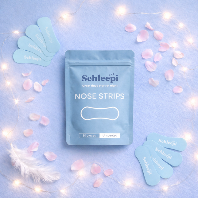 SchleepStrips™ Nose Strips on soft fabric with petals and warm lights, helping families thrive with calm support.