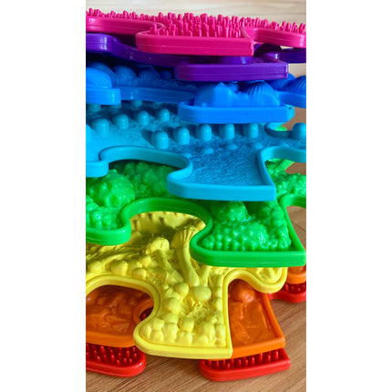 Rainbow Tactile Floor mat Set with vibrant multicolor textured puzzle pieces for sensory and educational play.