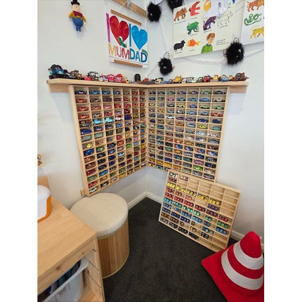 JCAR 105 — Diecast Display Rack filled with colorful model cars in a cozy family room setting helping families thrive.