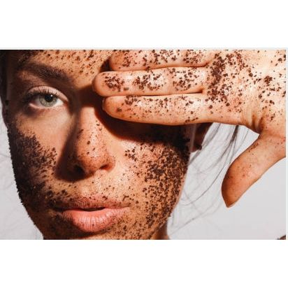 Close-up of a woman with Fresh face Coffee Scrub Face Mask - Lightly Exfoliating Face Masque on skin, helping families thrive.