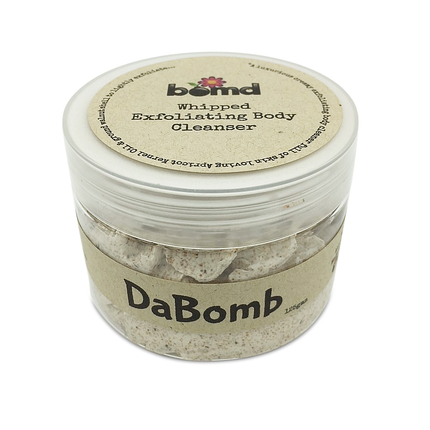 DaBomb Whipped Body Cleanser Soap Lightly Exfoliating in clear jar with natural beige label helping families thrive.