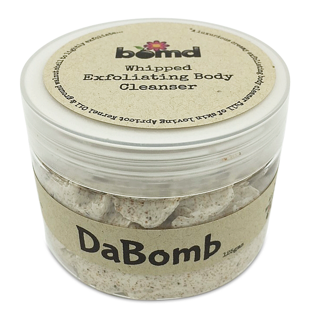DaBomb Whipped Body Cleanser Soap Lightly Exfoliating in clear jar with natural beige label helping families thrive.