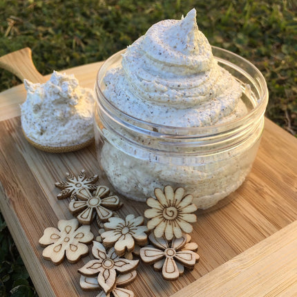 DaBomb Whipped Body Cleanser Soap Lightly Exfoliating in jar with wooden flower shapes, Helping families thrive with tools to calm.