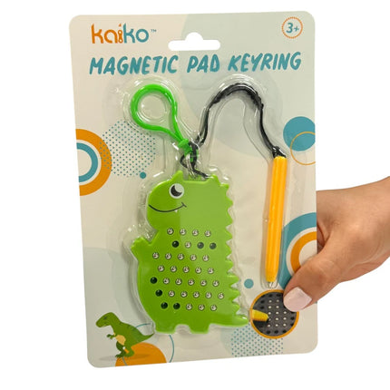 Dinosaur Magnetic Pad Keyring featuring a green dinosaur-shaped magnetic drawing board with a yellow magnetic pen attached by a black string.