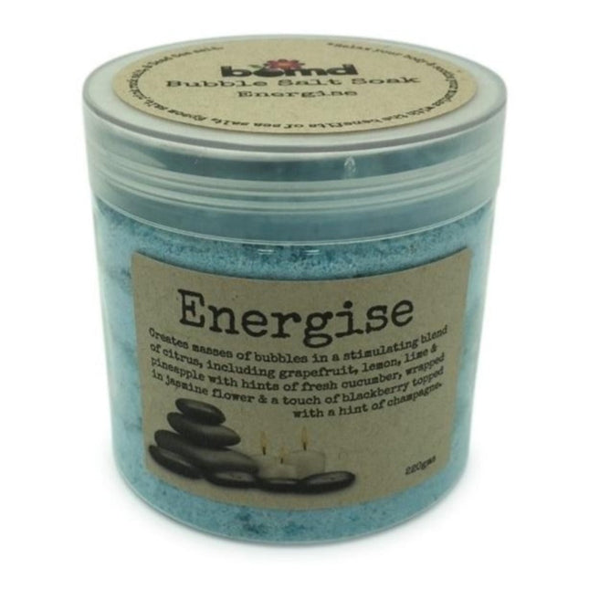 Energise Body Soak Bubbling Salt Crystal Muscle Soak in blue jar with calming spa stones and candles, helping families thrive.