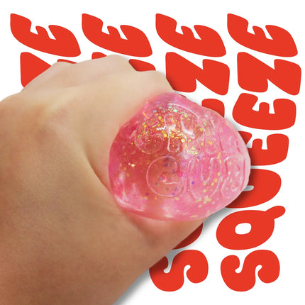 Chilly Cube Glittery pink glitter sensory squishy held in a hand