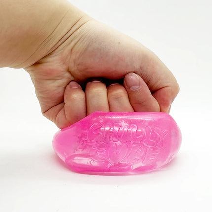 Chilly Cube Snowflake pink sensory squishy held in a hand
