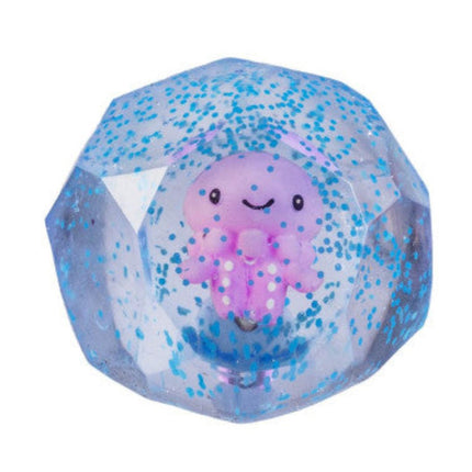 Smooshos Super Squeeze Diamond Sphere GID Sea Animal with a smiling purple octopus inside a clear glittery sphere squishy toy