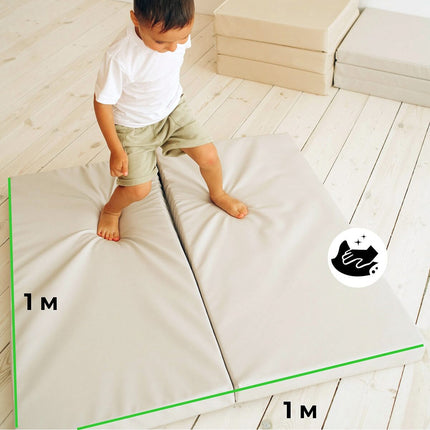Child stepping on Super Soft Foldable Landing Play Mats providing a safe, cushioned play area in a light-filled room.