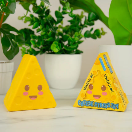 Gift Republic - Cheese Stress To yellow cheese shaped stress toy beside its packaging