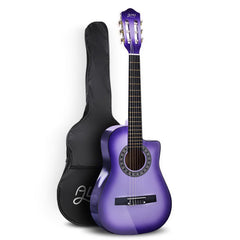 Purple acoustic guitar with a black padded gig bag on a white background