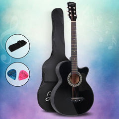 Black acoustic guitar with matching case, strap and two picks on a colorful background