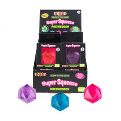 Smoosho's Super Squeeze Glow In The Dark Polyhedron fidget toys in purple, blue, and red with packaging on display.