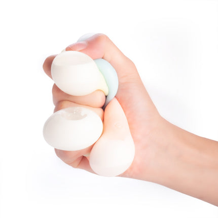 Squeezing Smoosho's Glow-in-the-Dark Sticky Splat Ballz - Set of 3 for sensory fidget play and stress relief.