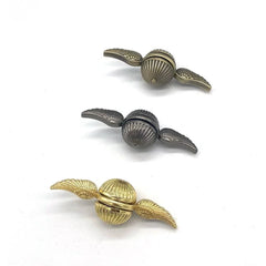 Three Harry Potter Snitch Metal Fidget Spinners in gold, silver, and bronze colors for sensory play.