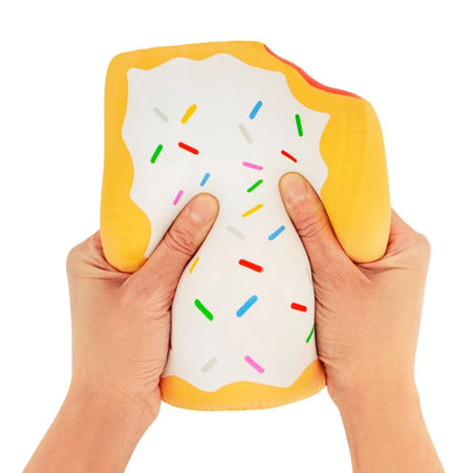 The Big Squij Poptart squishy fidget shaped like a frosted pastry being squeezed by hands
