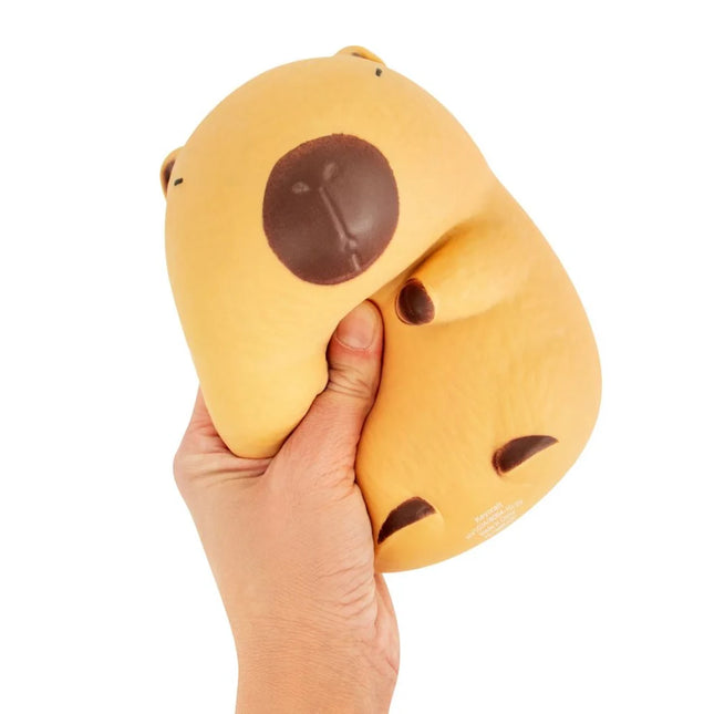 The Big Squij Capybara squishy toy held in one hand