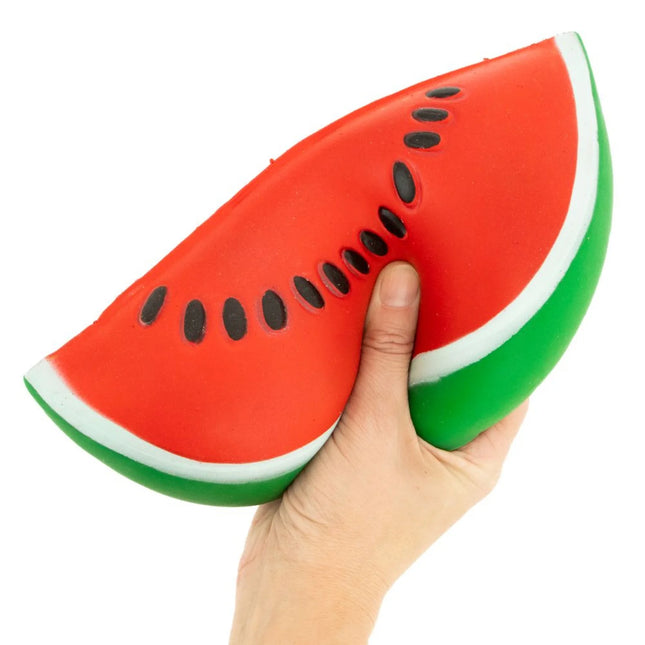 The Big Squij Watermelon red and green watermelon slice squishy fidget toy held in a hand
