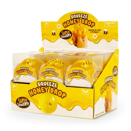 Honey Drop Ball yellow squishy bee sensory fidget toy in retail display box