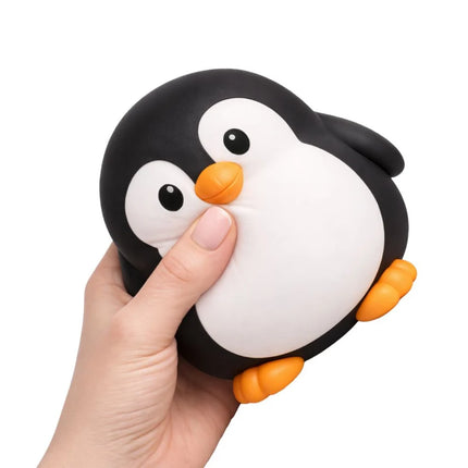 The Big Squij Penguin Slow-Rise Squishy Toy being squeezed by hand