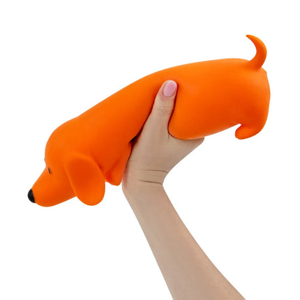 The Big Squij Dachshund Slow-Rise Squishy Toy held in a hand