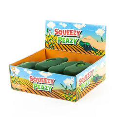 Display box of green Squeezy Peas in Pod sensory toys, designed to calm and support children and adults.