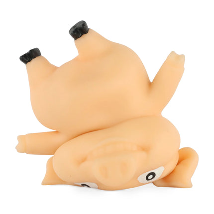 Stretch 'N Smash Pig sensory squishy toy shaped like a pig lying upside down with black hooves and wide eyes.