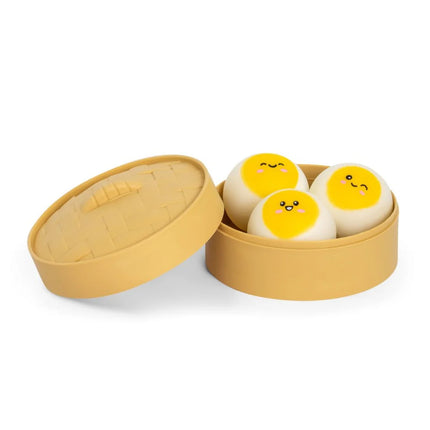 Cuddle Buns (3 pack) three yellow and white squishy toys in a round storage case