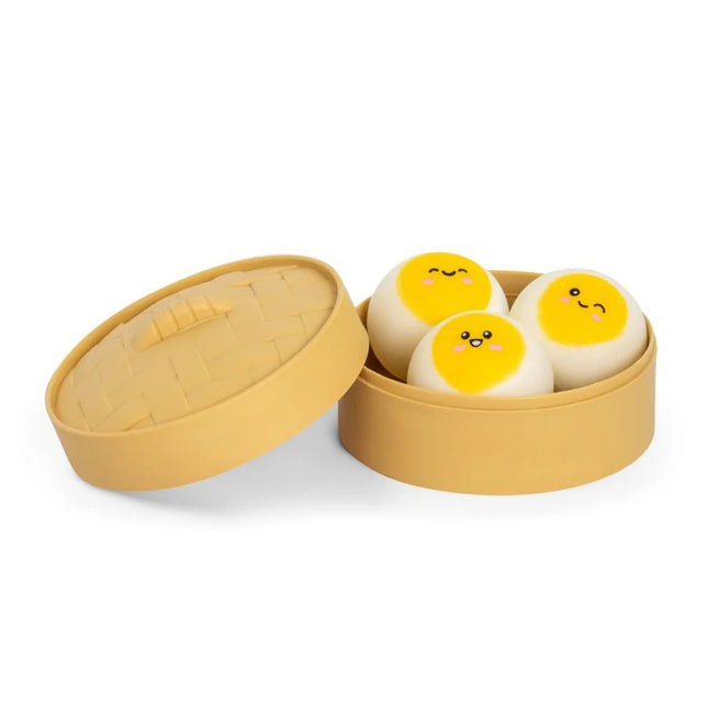 Cuddle Buns (3 pack) three yellow and white squishy toys in a round storage case