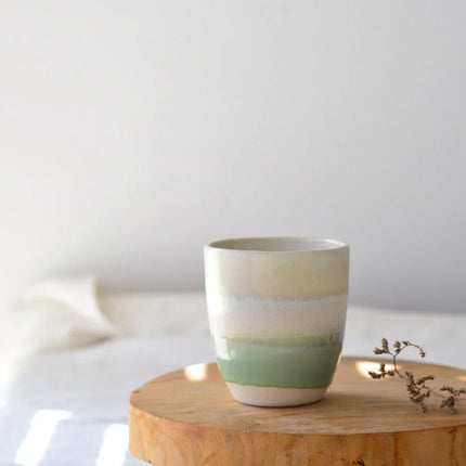 SUNDAY MORNING GIFT BOX featuring calming ceramic cup with natural tones on wooden surface, helping families thrive.