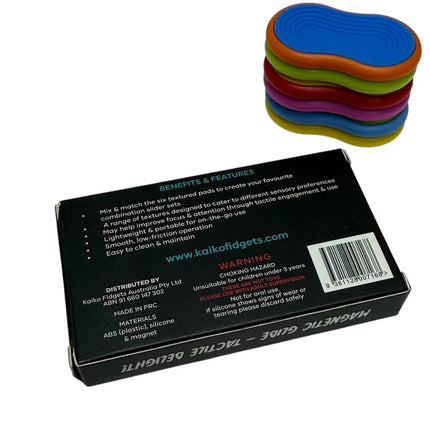 Mag Sliders - Six Interchangeable Magnetic Textured Pad Fidgets stacked beside black packaging with product details and warnings
