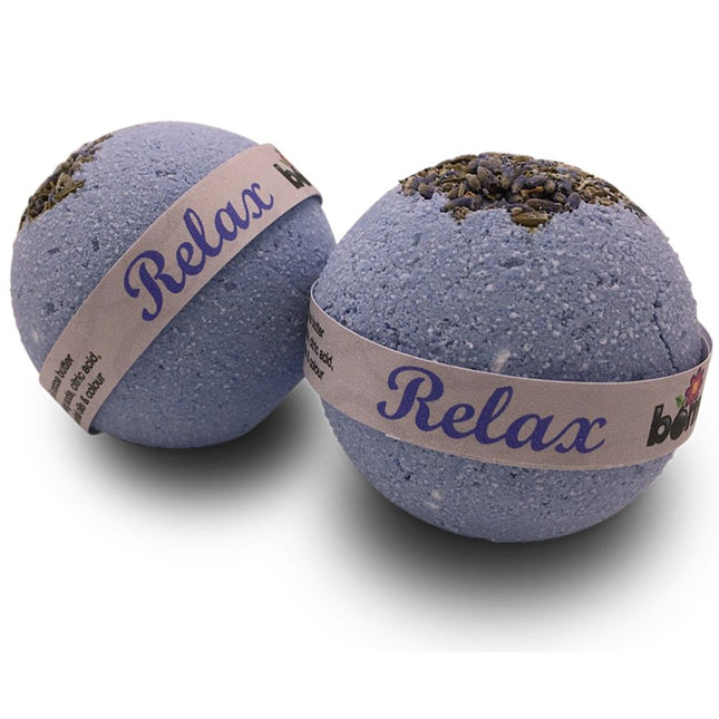 Two lavender-scented bath bombs with labels saying Relax from the Relax Bedtime Lavender Body Soak Bomb Set of 6, helping families thrive with tools to calm, connect and support.