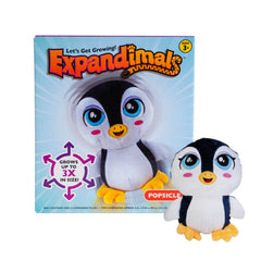 Penguin Expandimal Plush with big blue eyes, yellow feet, and a soft black and white body beside its colorful packaging