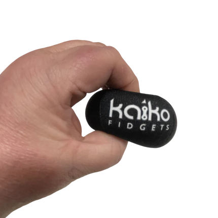 5 Piece Hand Grip Set by Kaiko - for Regulation and Improved Function held in hand showing black stress relief fidget tool
