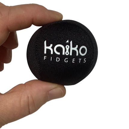 Hand holding a black Kaiko fidget ball from the 5 Piece Hand Grip Set by Kaiko - for Regulation and Improved Function