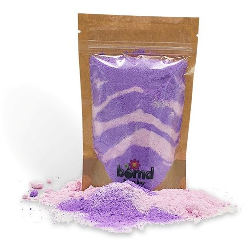 Love Spell Fizzing Bubble Bath Dust in purple and pink powder, helping families thrive with calm and support.